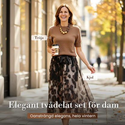 Tvådelat set för kvinnor med tröja och fladdrande leopardmönstrad kjol