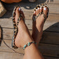 Flip-flops med leopardmönster och hjärtberlock