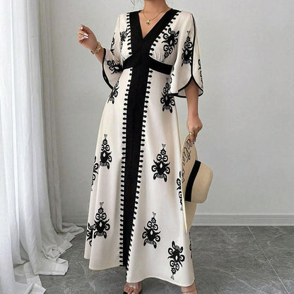 👗 50 % RABATT! 🌸 Elegant V-ringad maxiklänning – smickrande passform, luftig & mönstrad, perfekt för bröllop, middag & strand 🌿