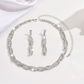 Set med halsband och örhängen med glittrande strass och klorformad kedja för kvinnor