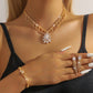Elegant smyckeset med lotusmotiv och strass